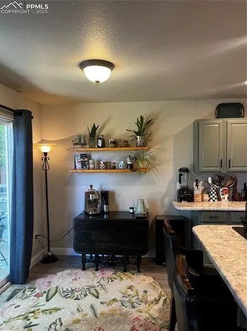 a room with a bed and a dresser