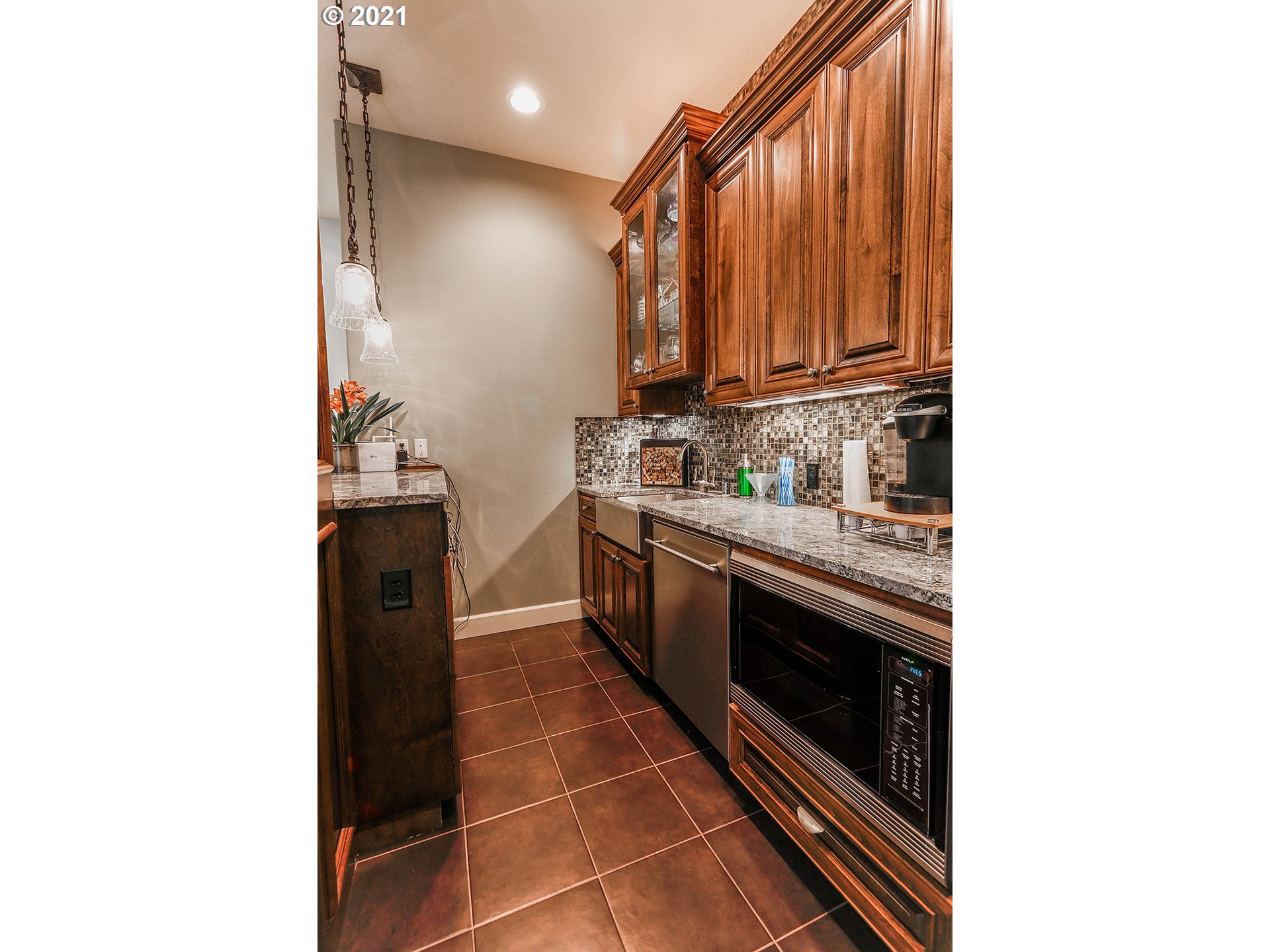 531 South 19th Place Ridgefield, WA 98642 - Photo 19 of 32 a kitchen with stainless steel appliances a sink and cabinets