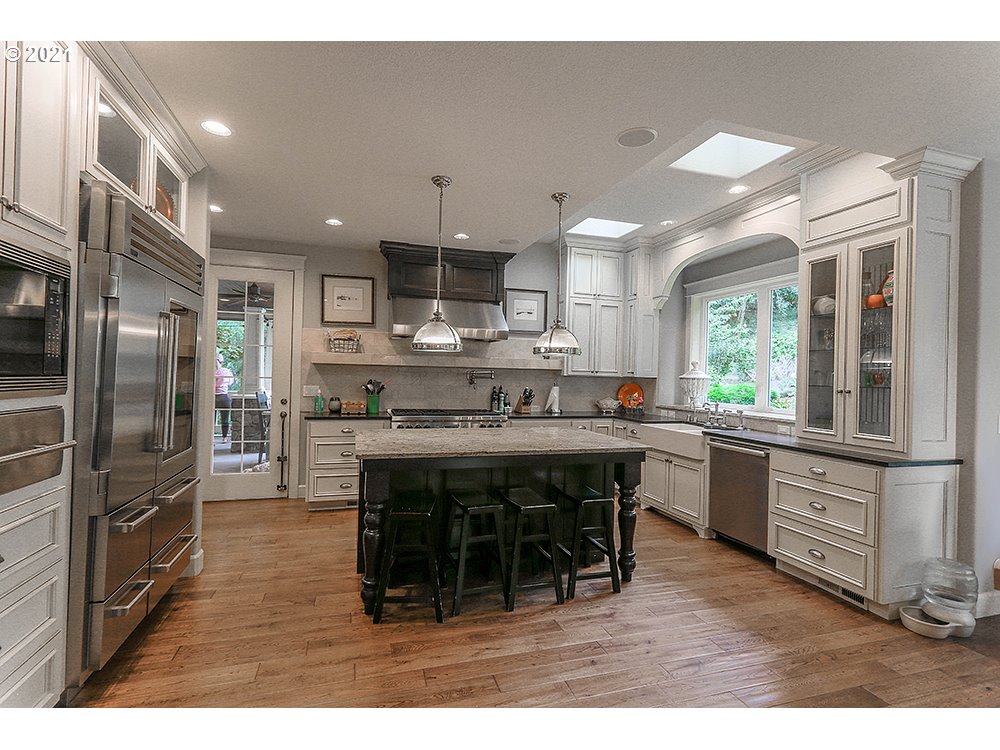 531 South 19th Place Ridgefield, WA 98642 - Photo 6 of 32 a kitchen with stainless steel appliances granite countertop a sink a stove and a refrigerator