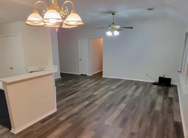 a view of a livingroom with wooden floor