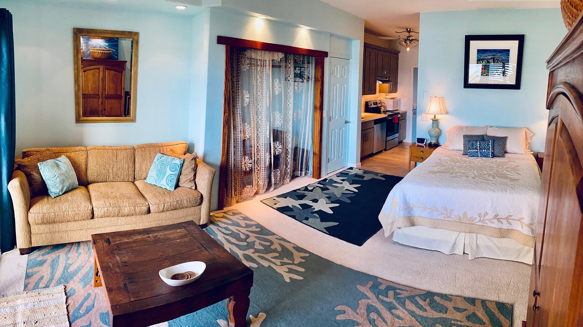 4435 Lower Honoapiilani Road, Unit 205 Lahaina, HI 96761 - Photo 14 of 26 a bed room with a bed and a couch