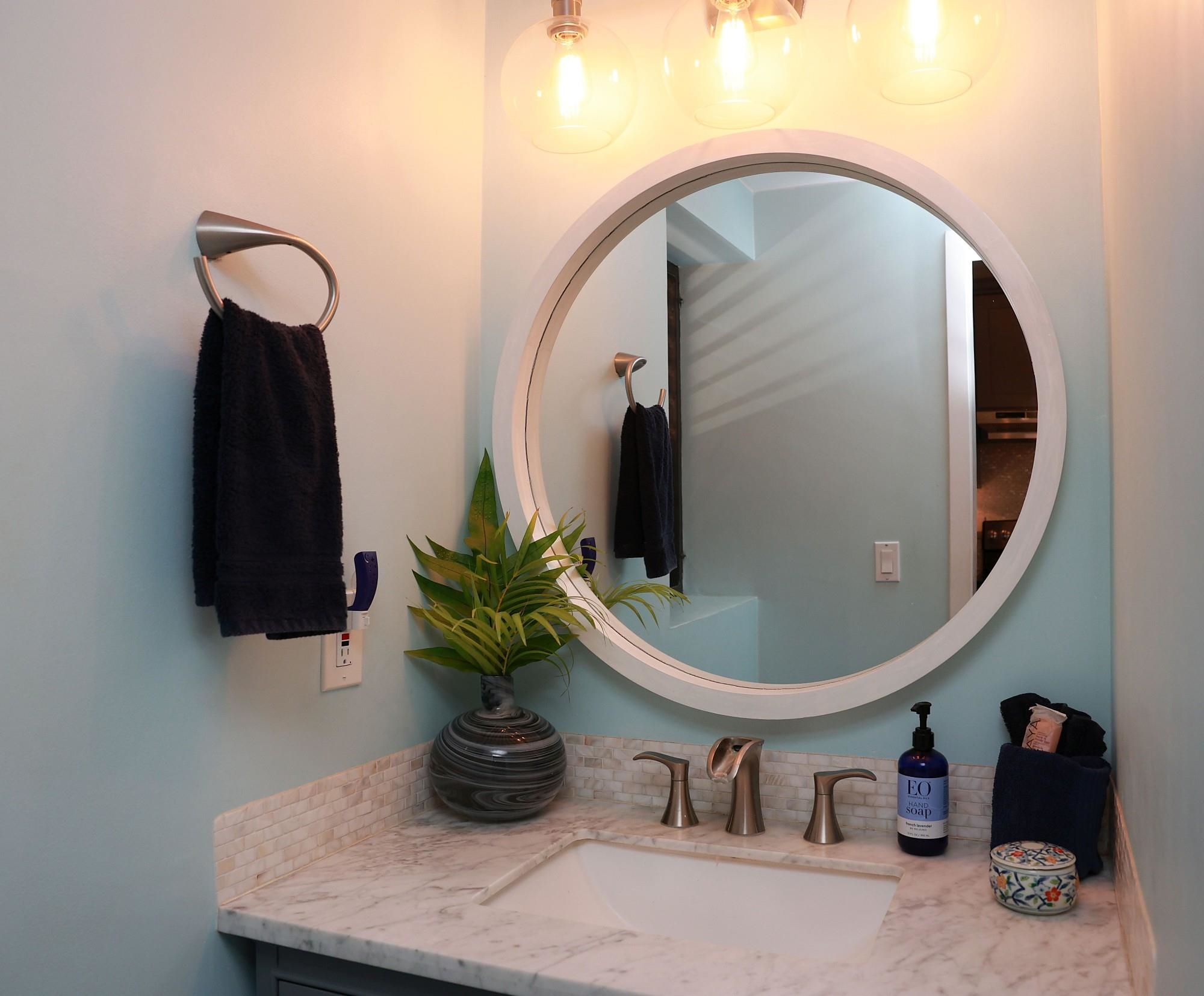 4435 Lower Honoapiilani Road, Unit 205 Lahaina, HI 96761 - Photo 24 of 26 a bathroom with a sink and a mirror