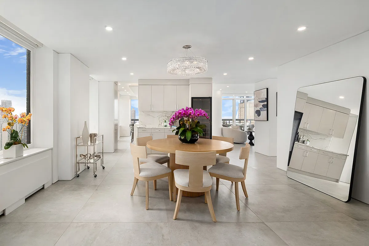 422 East 72nd Street, Unit 37AD Manhattan, NY 10021 - Photo 10 of 58 a dining room with furniture and window