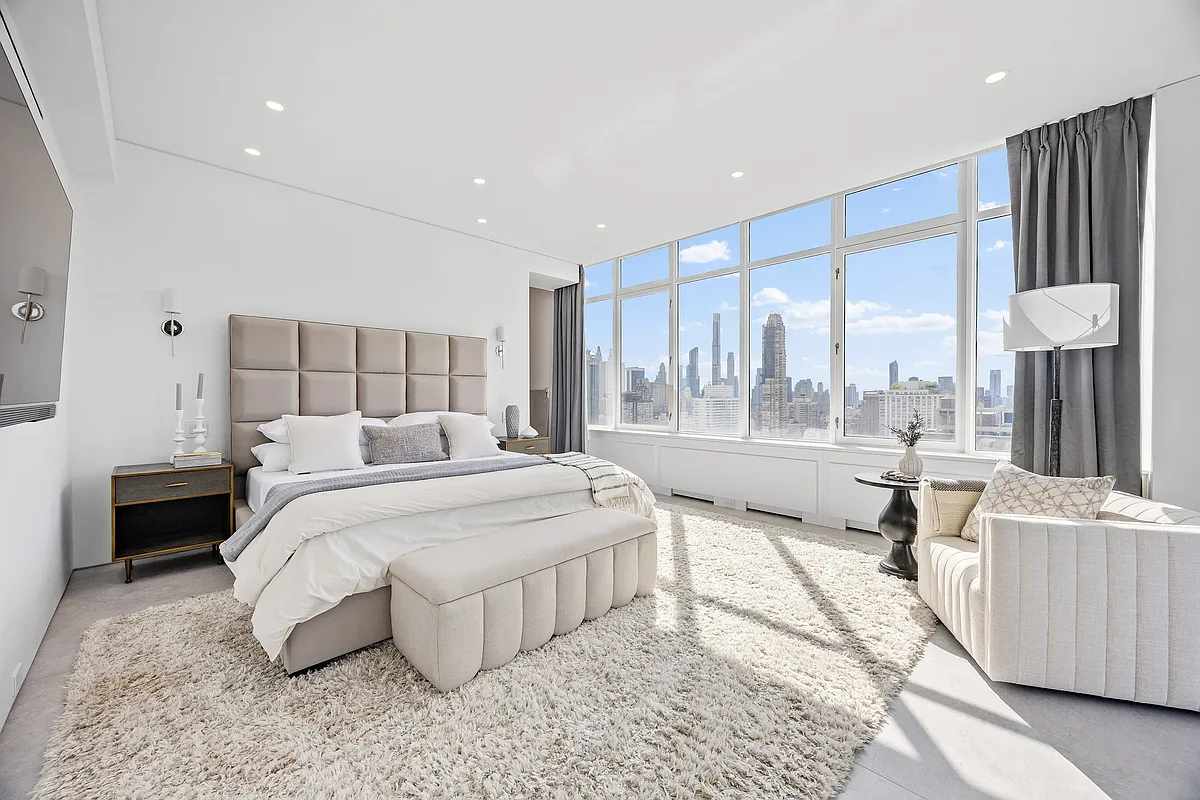 422 East 72nd Street, Unit 37AD Manhattan, NY 10021 - Photo 13 of 58 a large bedroom with a large bed and a large window
