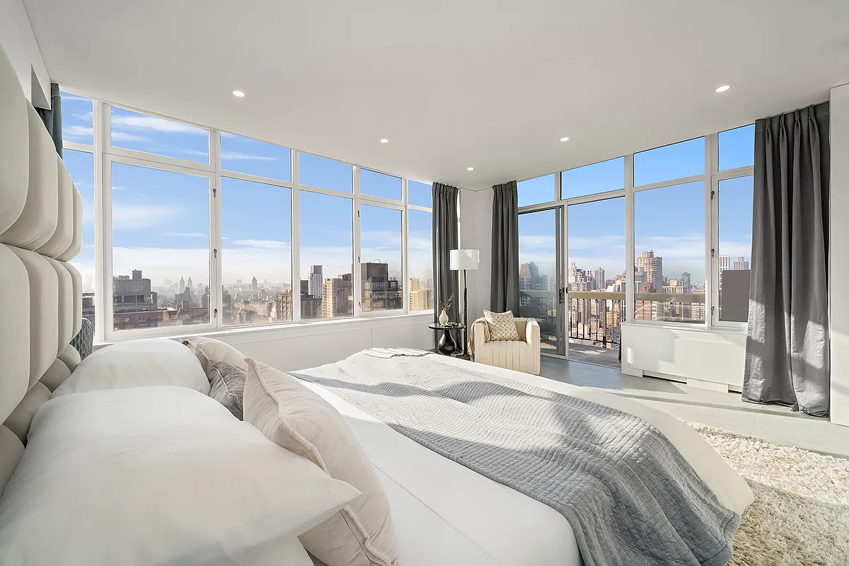 422 East 72nd Street, Unit 37AD Manhattan, NY 10021 - Photo 22 of 58 a large bedroom with a large window and a bed