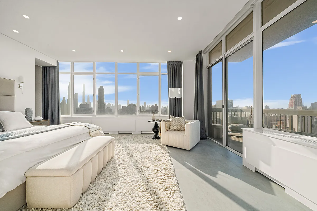 422 East 72nd Street, Unit 37AD Manhattan, NY 10021 - Photo 23 of 58 a bed room with large bed and a large window