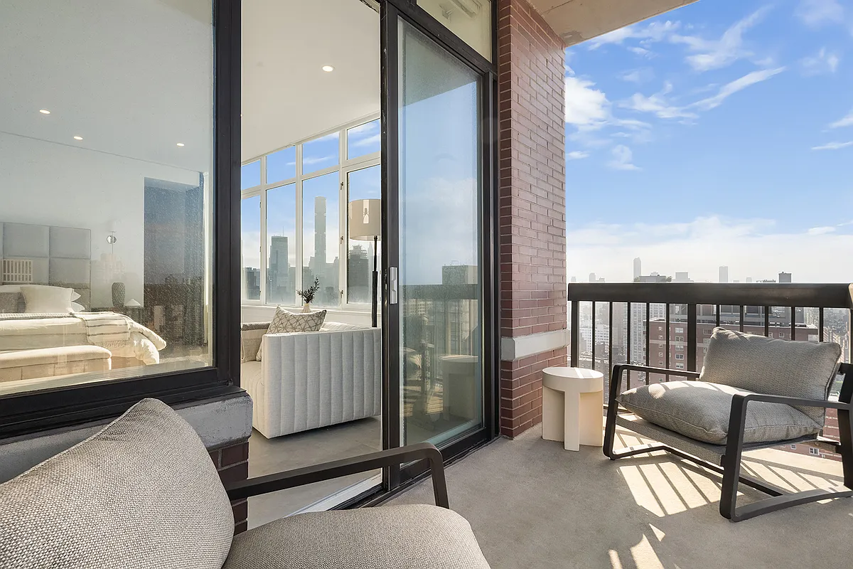 422 East 72nd Street, Unit 37AD Manhattan, NY 10021 - Photo 31 of 58 a bedroom with furniture and a floor to ceiling window