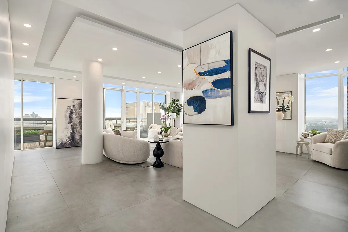 422 East 72nd Street, Unit 37AD Manhattan, NY 10021 - Photo 3 of 58 a living room with furniture and a flat screen tv
