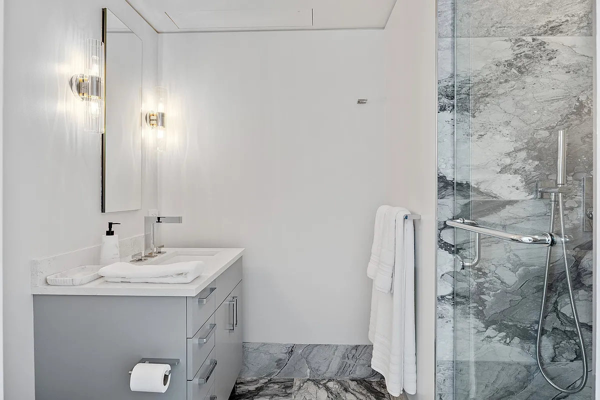 422 East 72nd Street, Unit 37AD Manhattan, NY 10021 - Photo 42 of 58 a bathroom with a sink and a mirror