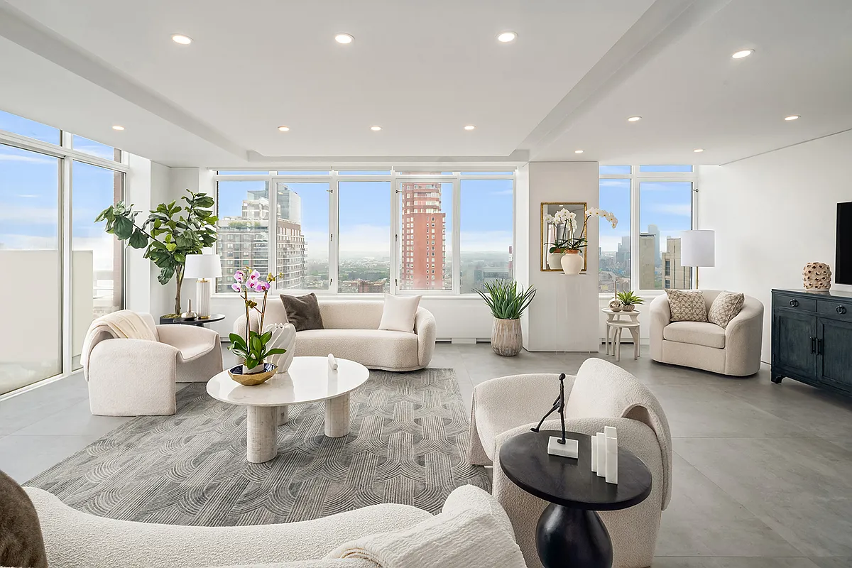 422 East 72nd Street, Unit 37AD Manhattan, NY 10021 - Photo 4 of 58 a living room with furniture and a potted plant