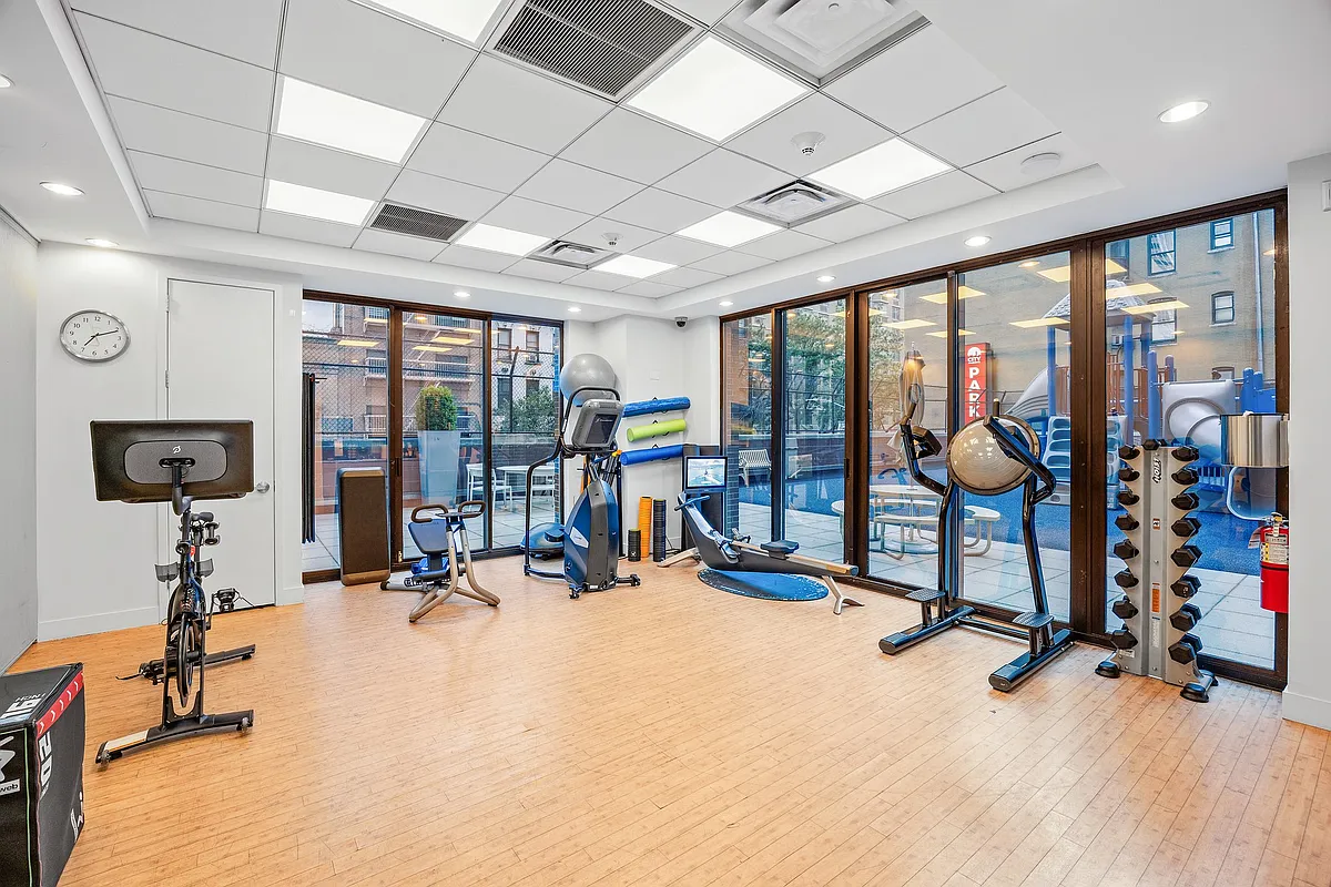 422 East 72nd Street, Unit 37AD Manhattan, NY 10021 - Photo 52 of 58 a view of a room with gym equipment