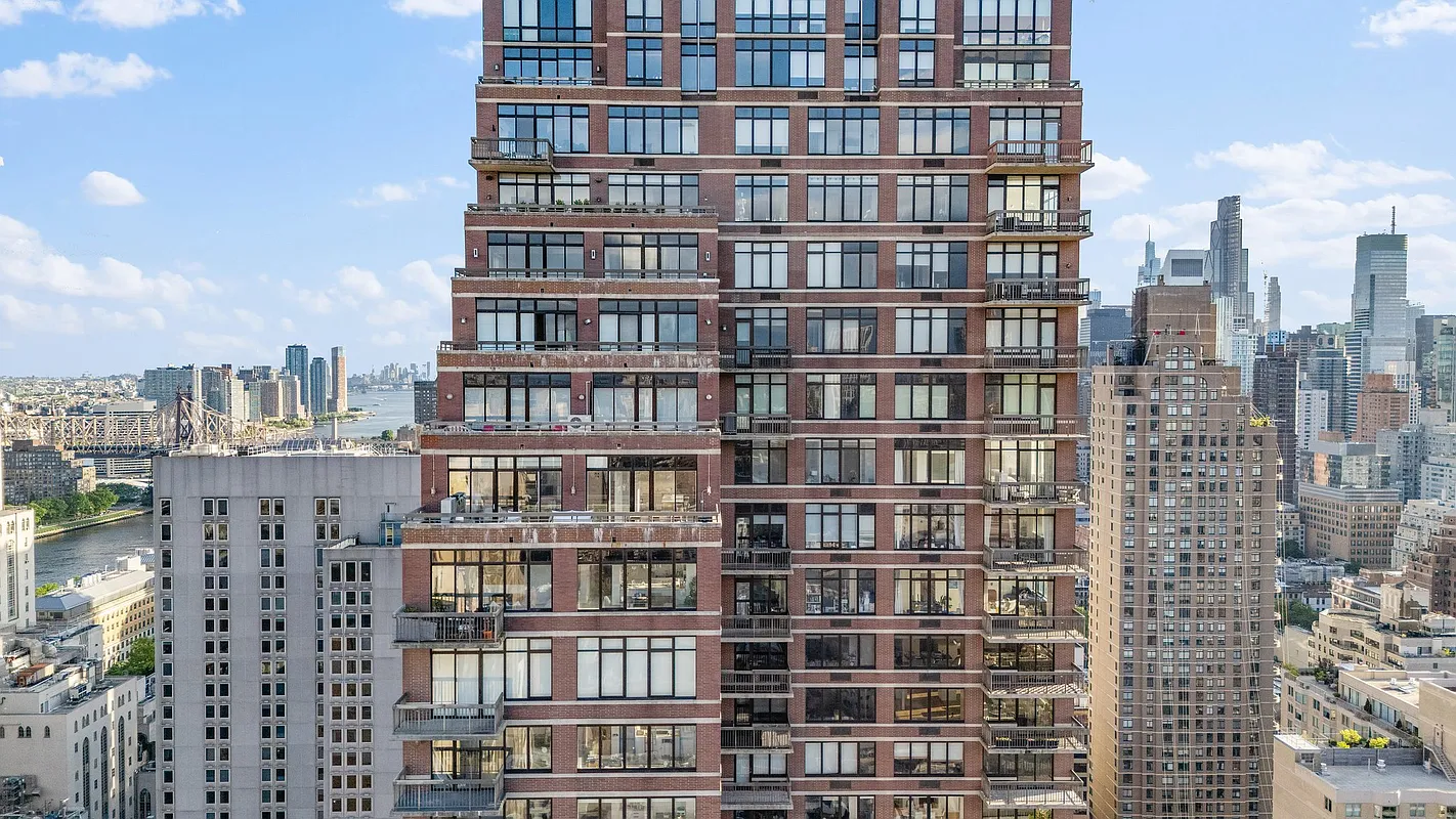 422 East 72nd Street, Unit 37AD Manhattan, NY 10021 - Photo 57 of 58 a view of a building with a lot of windows