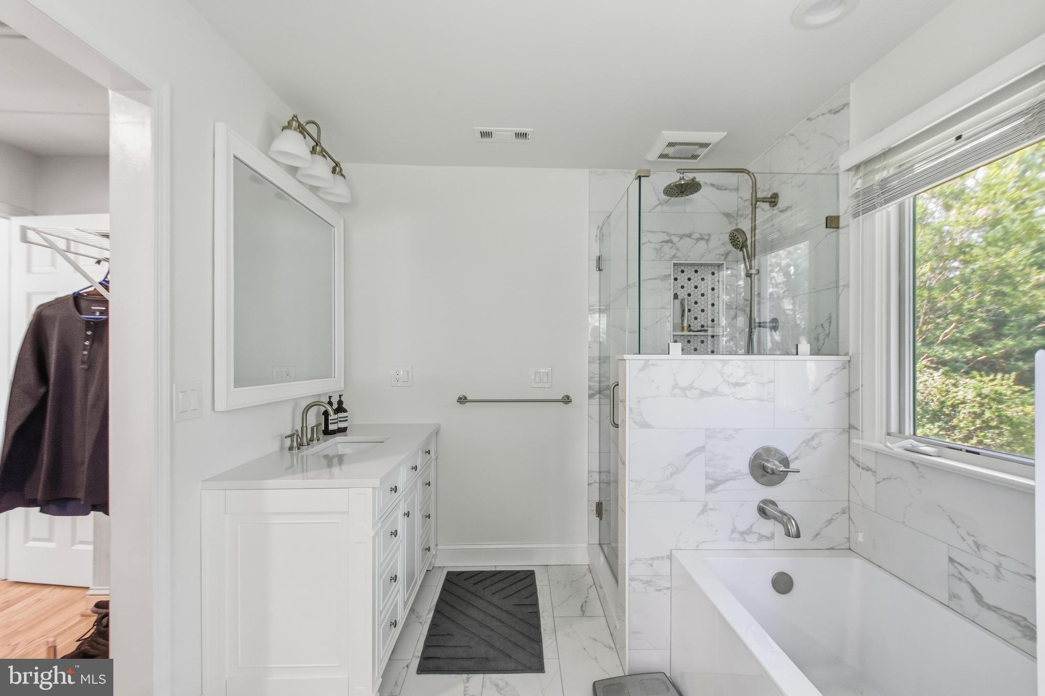 215 West George Mason Road Falls Church, VA 22046 - Photo 28 of 50 a bathroom with a tub sink and mirror