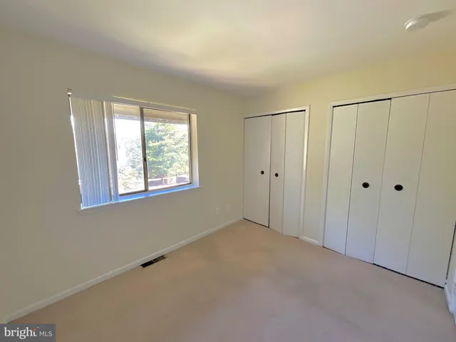 a bathroom with a toilet sink and a mirror