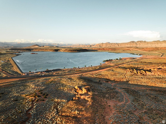 1693 Devils Gdn Lane Washington, UT 84780 - Photo 57 of 64 Expansive lake with surrounding desert landscape and distant mountains
