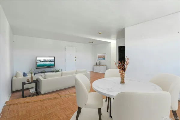 a dining room with furniture and window