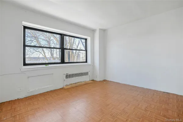 a view of an empty room with a window