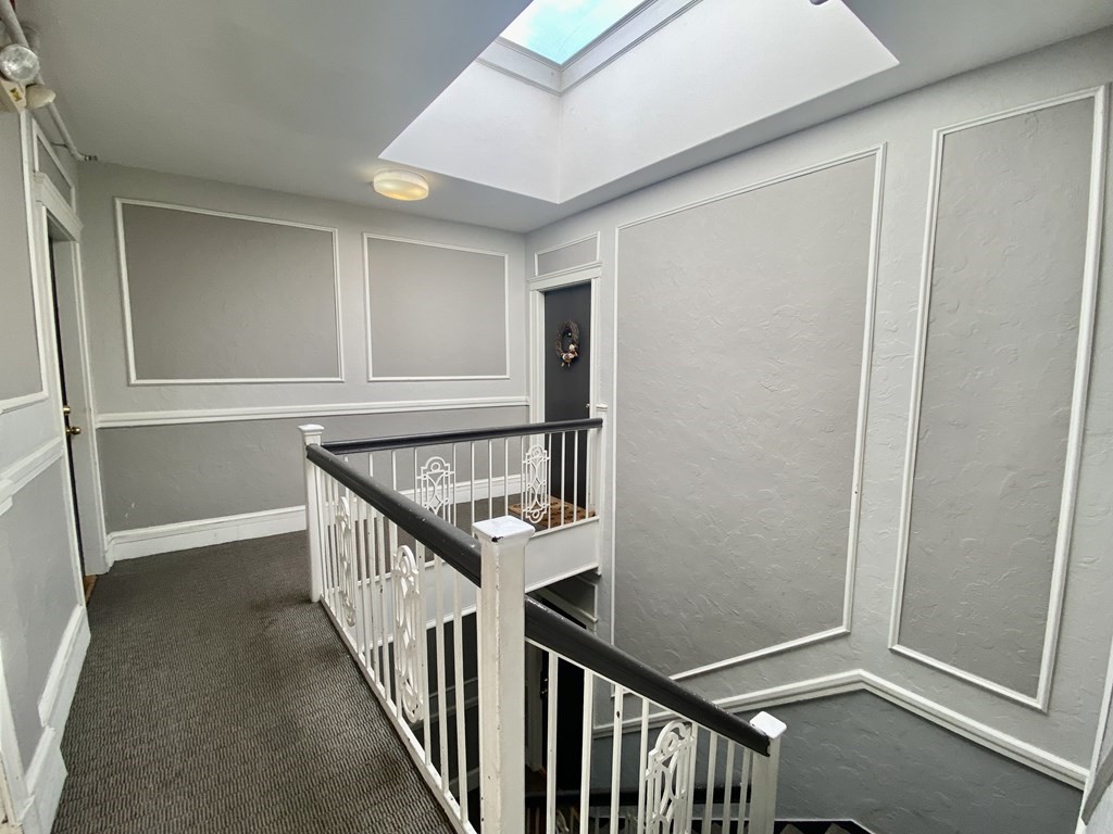 1691 Commonwealth Avenue, Unit 31 Boston, MA 02135 - Photo 8 of 12 a view of entryway with stairs
