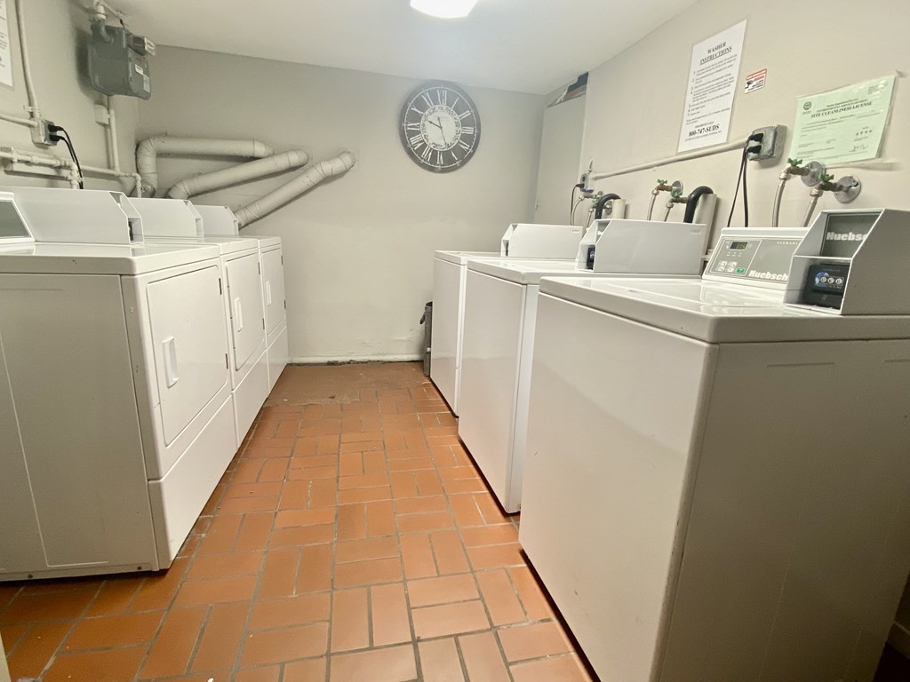 1691 Commonwealth Avenue, Unit 31 Boston, MA 02135 - Photo 9 of 12 a utility room with dryer and washer