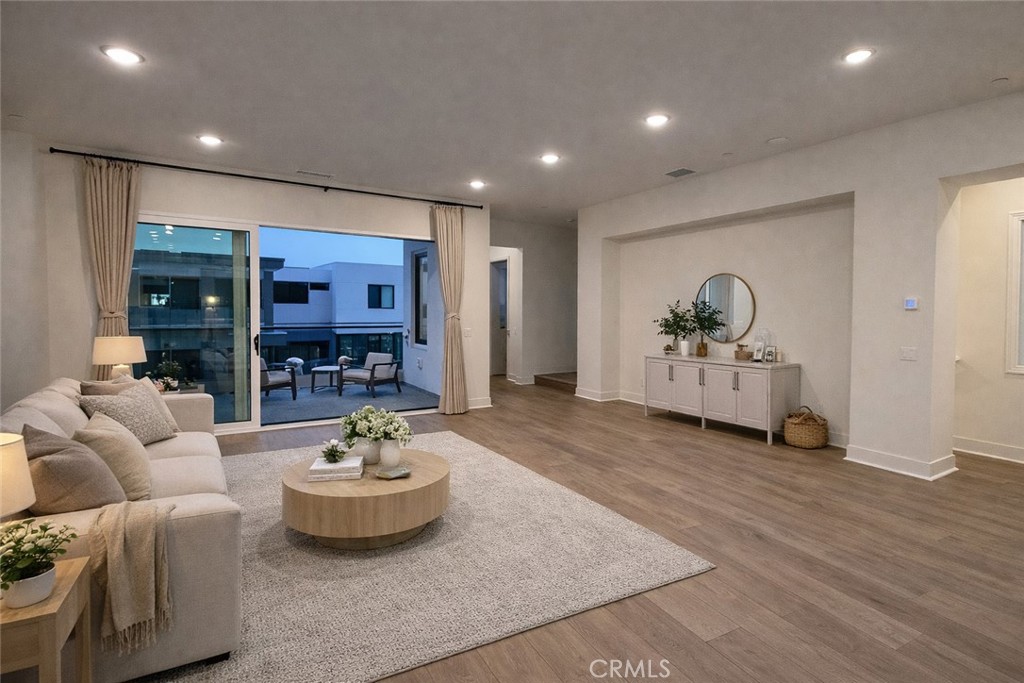 2173 Swaim Way Tustin, CA 92782 - Photo 12 of 34 a living room with furniture and a view of kitchen