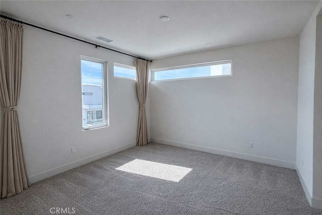 2173 Swaim Way Tustin, CA 92782 - Photo 19 of 34 an empty room with windows