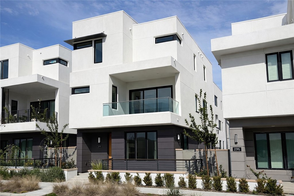 2173 Swaim Way Tustin, CA 92782 - Photo 2 of 34 a view of a white building with many windows