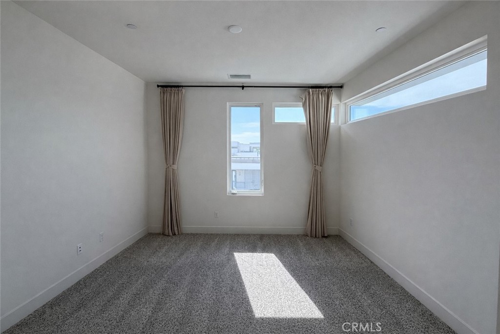 2173 Swaim Way Tustin, CA 92782 - Photo 21 of 34 an empty room with windows