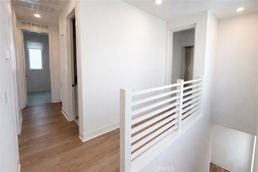 2173 Swaim Way Tustin, CA 92782 - Photo 29 of 34 a view of a hallway with wooden floor and closet