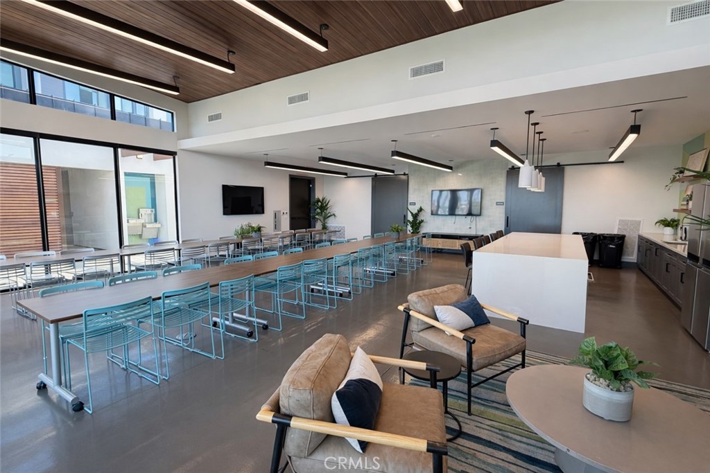 2173 Swaim Way Tustin, CA 92782 - Photo 32 of 34 a dining room with furniture a rug and wooden floor