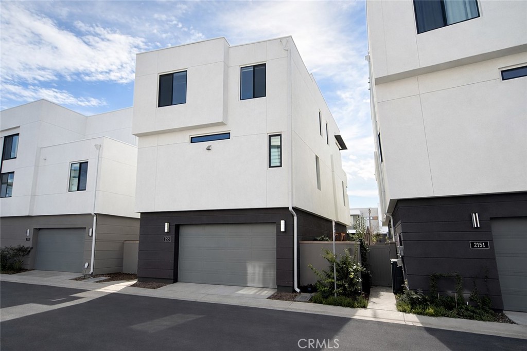 2173 Swaim Way Tustin, CA 92782 - Photo 4 of 34 a front view of a building with garage