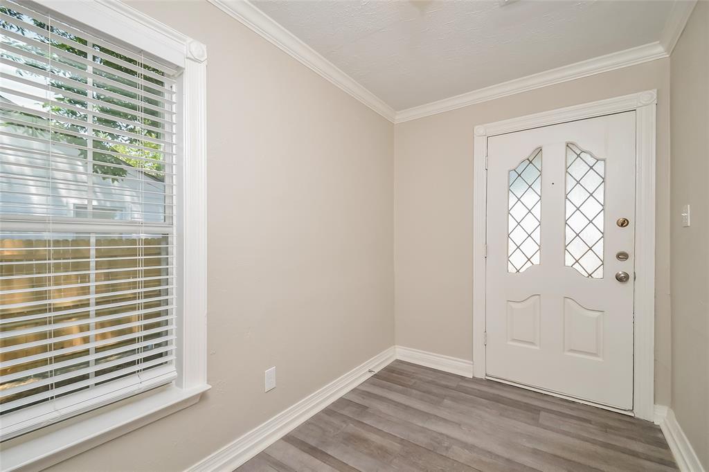 808 22nd Street Plano, TX 75074 - Photo 11 of 16 an empty room with wooden floor and windows