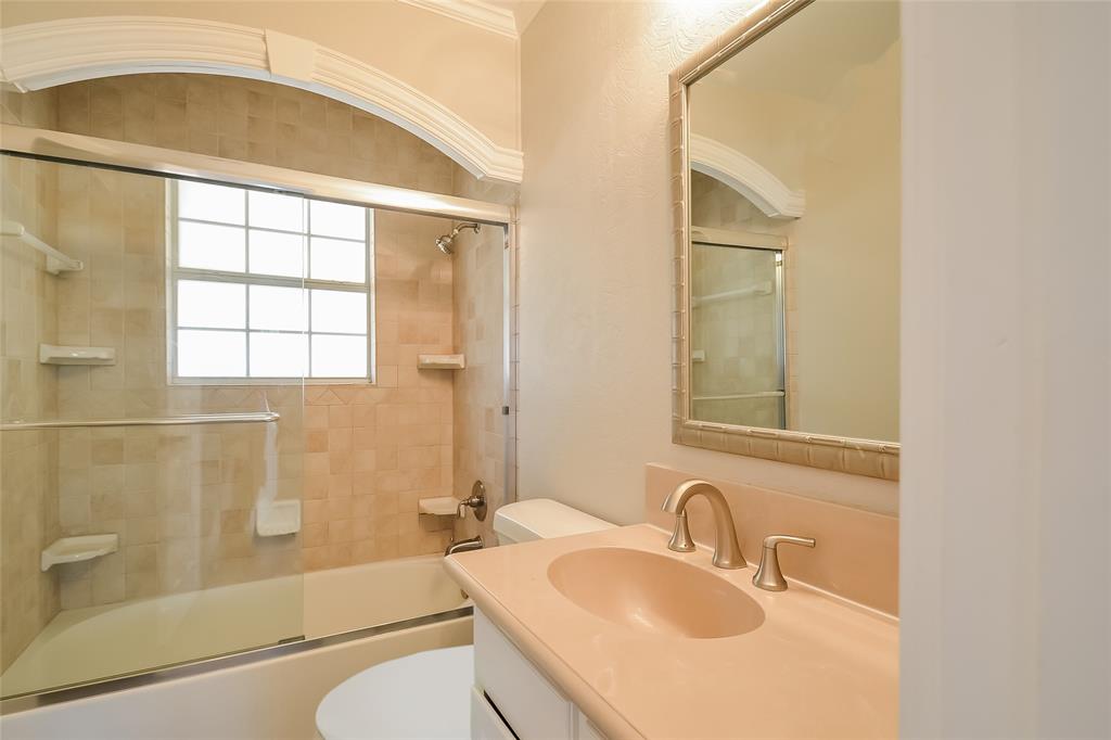 808 22nd Street Plano, TX 75074 - Photo 12 of 16 a bathroom with a sink toilet and shower