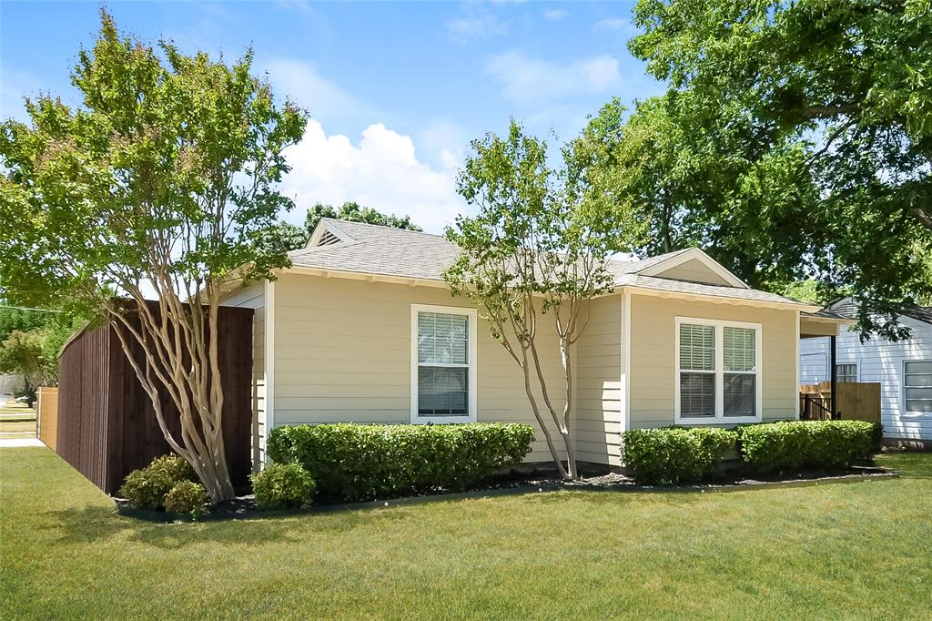 808 22nd Street Plano, TX 75074 - Photo 2 of 16 a front view of a house with a yard and garage