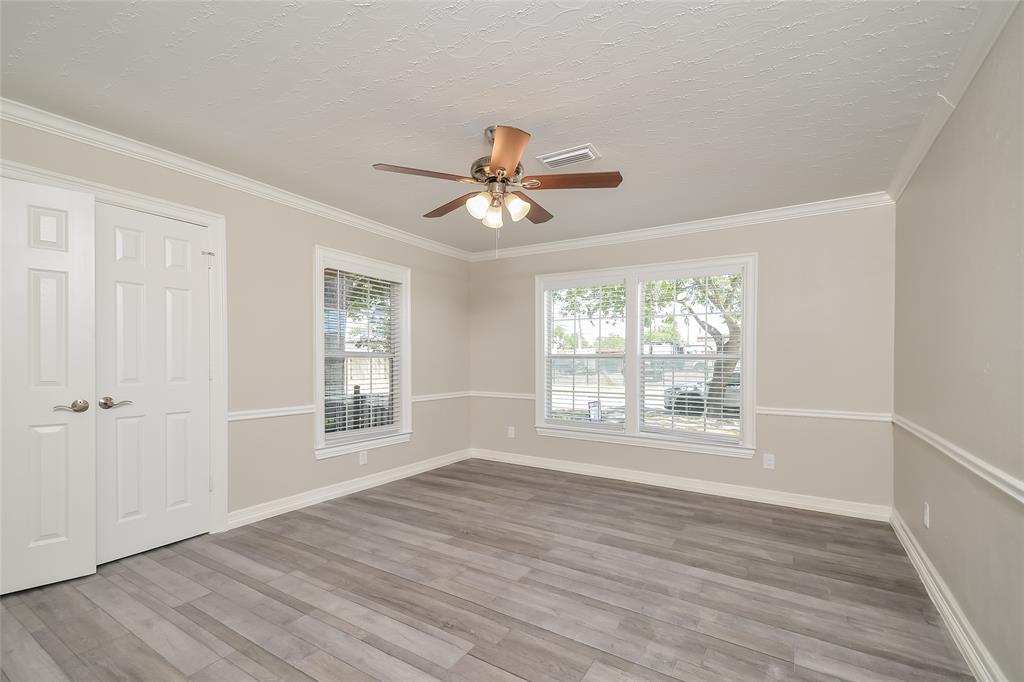 808 22nd Street Plano, TX 75074 - Photo 7 of 16 a view of an empty room with a window and a chandelier fan