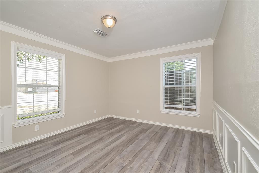 808 22nd Street Plano, TX 75074 - Photo 8 of 16 an empty room with wooden floor and windows