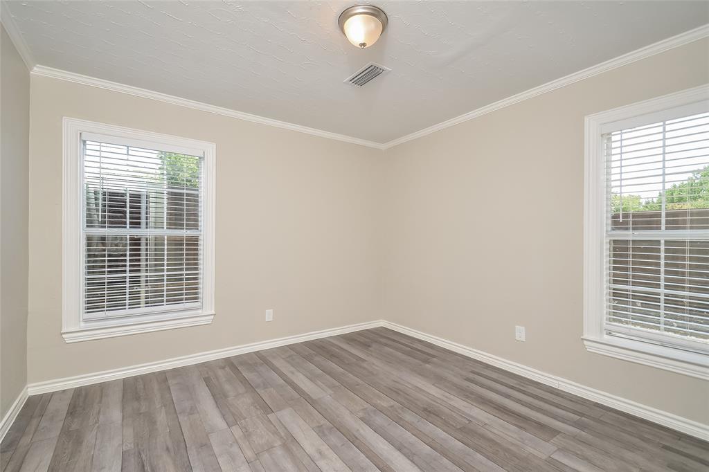 808 22nd Street Plano, TX 75074 - Photo 9 of 16 a view of a room with wooden floor and windows