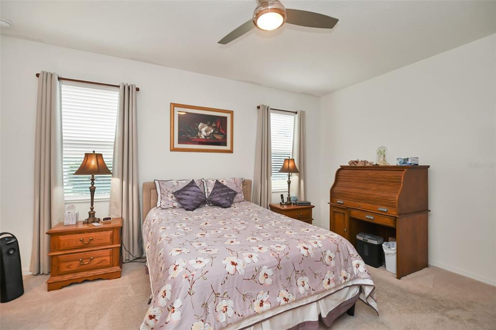8237 Southwest 78th Terrace Road Ocala, FL 34476 - Photo 13 of 22 a bedroom with a bed and wooden floor