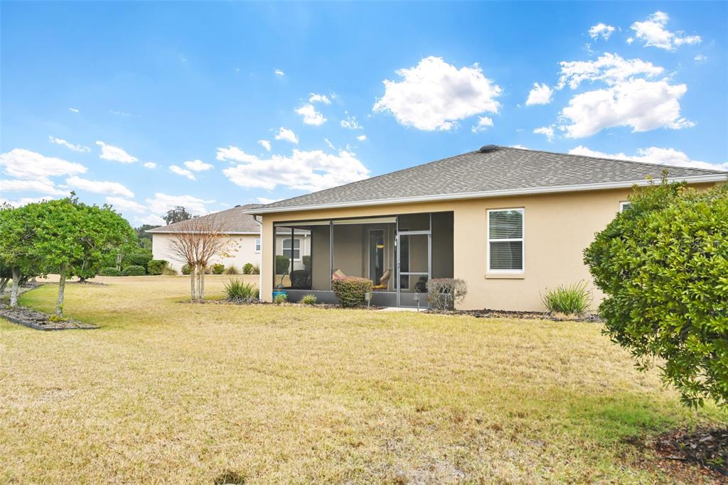 8237 Southwest 78th Terrace Road Ocala, FL 34476 - Photo 20 of 22 a view of a house with a patio
