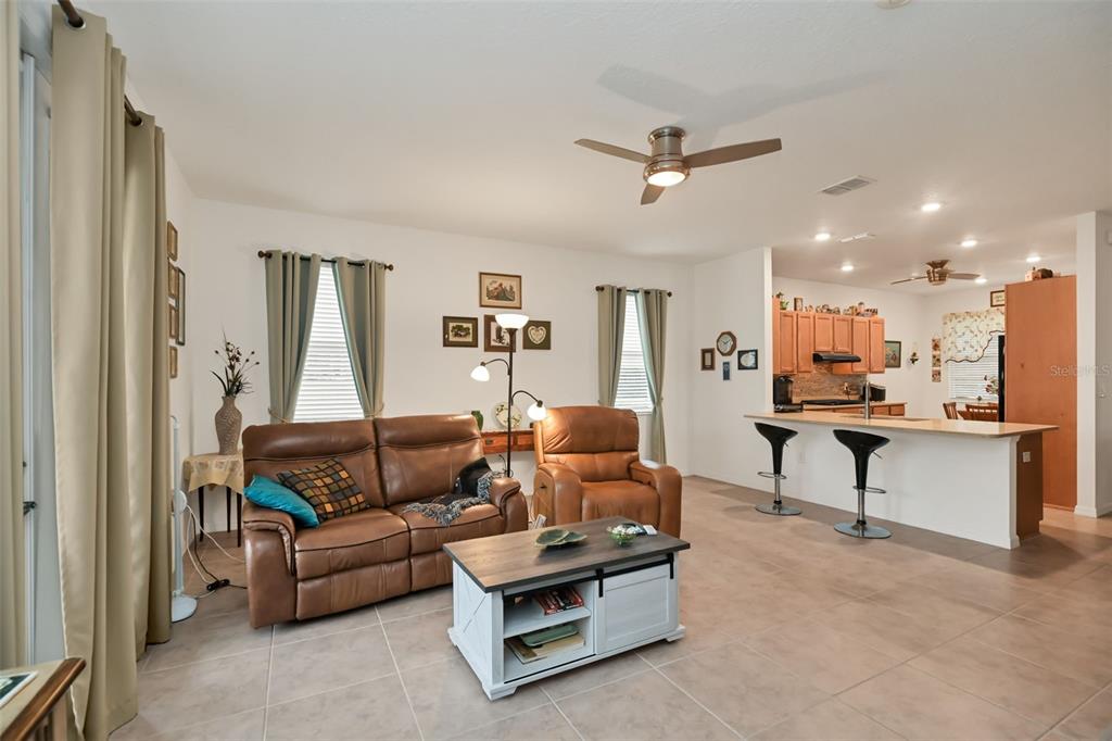 8237 Southwest 78th Terrace Road Ocala, FL 34476 - Photo 10 of 22 a living room with furniture and kitchen view
