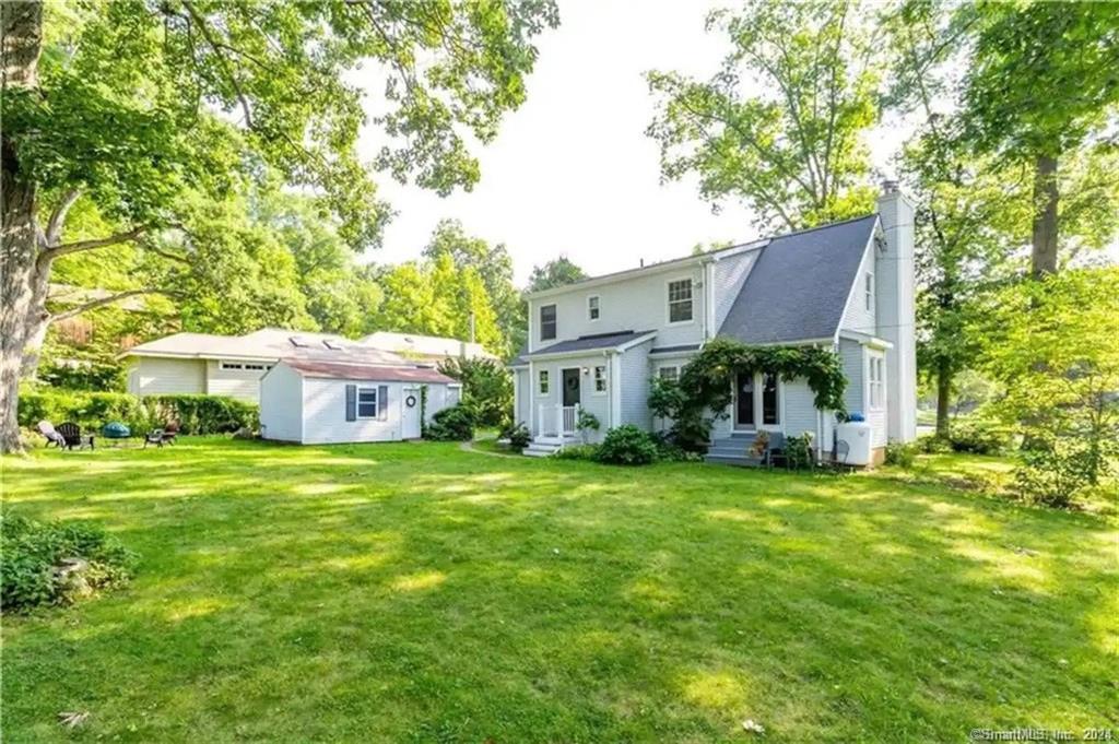 9 Beech Street Farmington, CT 06032 - Photo 1 of 37 a view of a house with a yard and sitting area