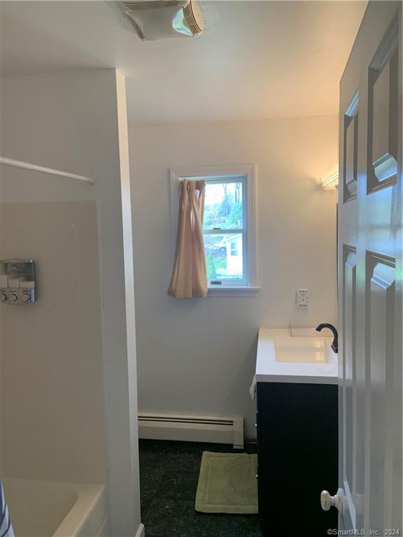 9 Beech Street Farmington, CT 06032 - Photo 18 of 37 a bathroom with a sink and a mirror