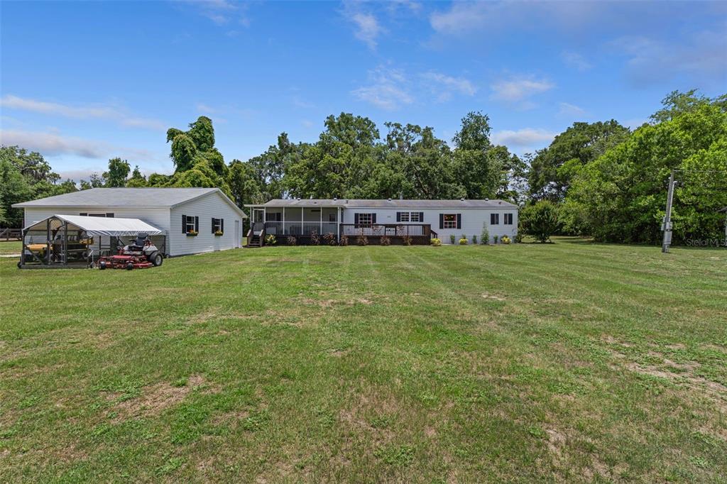 26255 Lambeth Road Brooksville, FL 34601 - Photo 58 of 76 a view of a house with a big yard