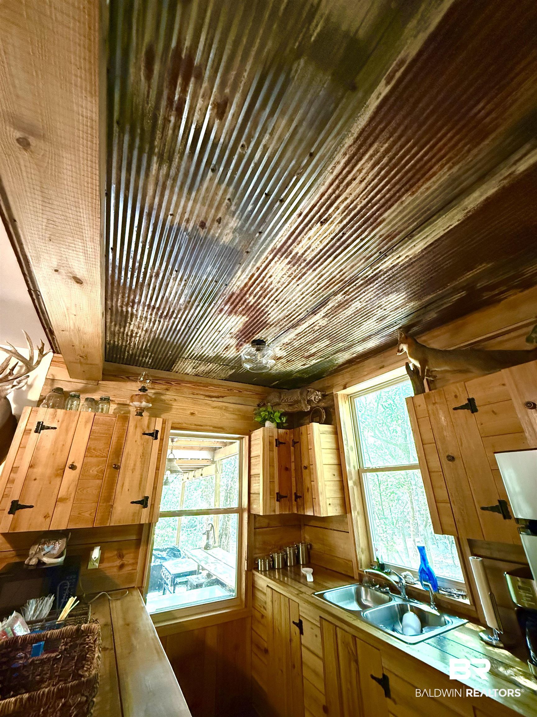 1 Mason Ferry Road Citronelle, AL 36522 - Photo 5 of 40 Galvanized metal ceiling with exposed wood beams