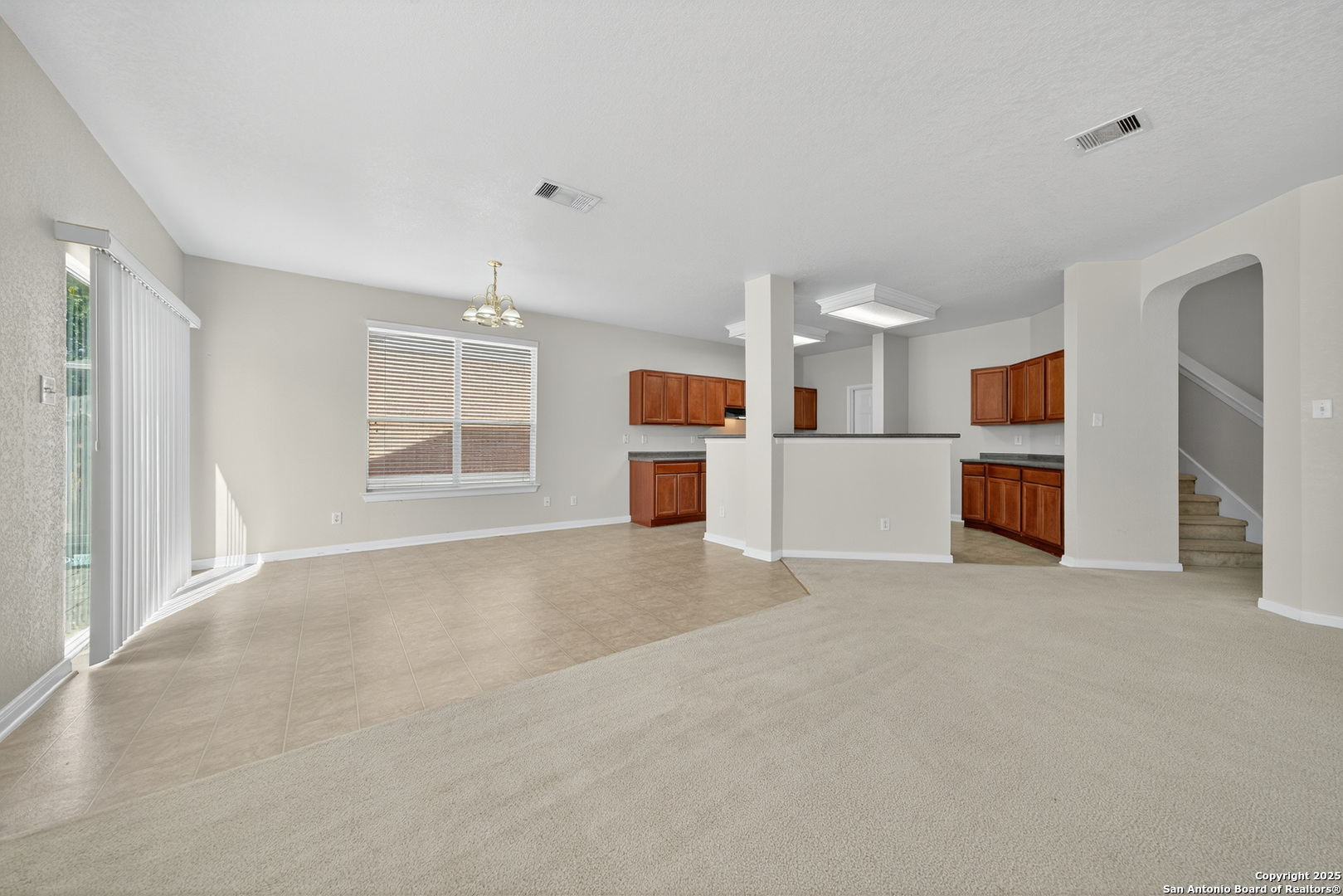 221 Springtree Cove Cibolo, TX 78108 - Photo 14 of 33 an empty room with a kitchen and a window