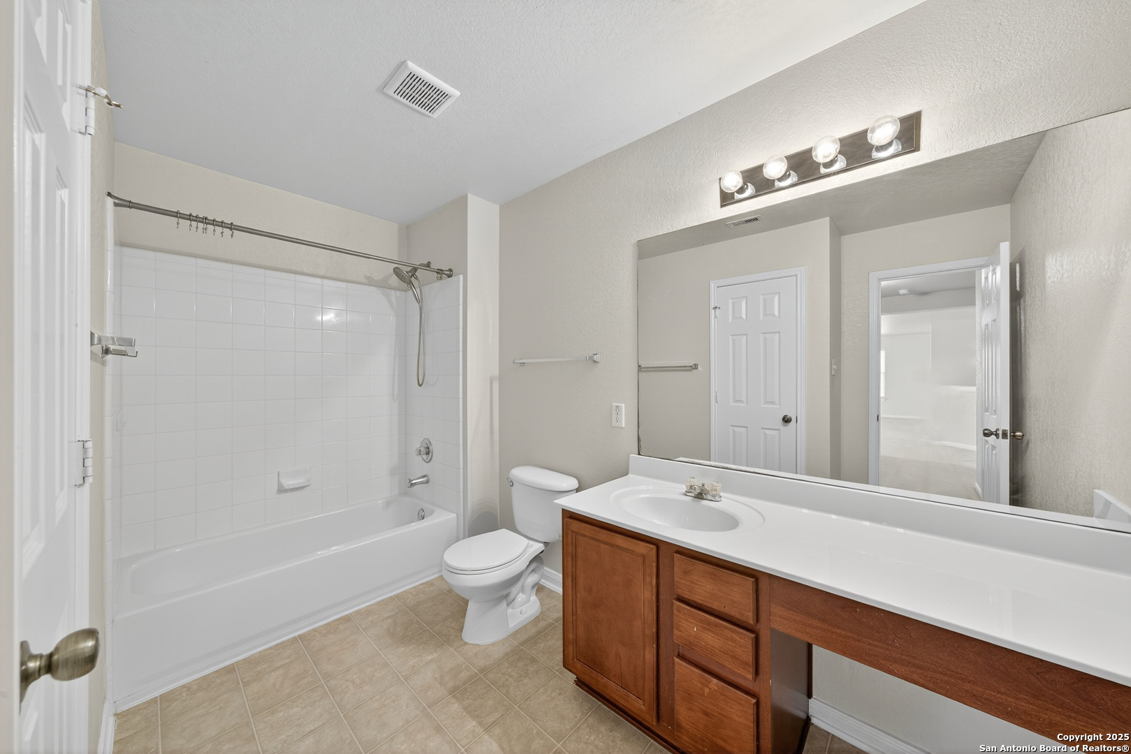 221 Springtree Cove Cibolo, TX 78108 - Photo 24 of 33 a bathroom with a double vanity sink toilet mirror and bathtub