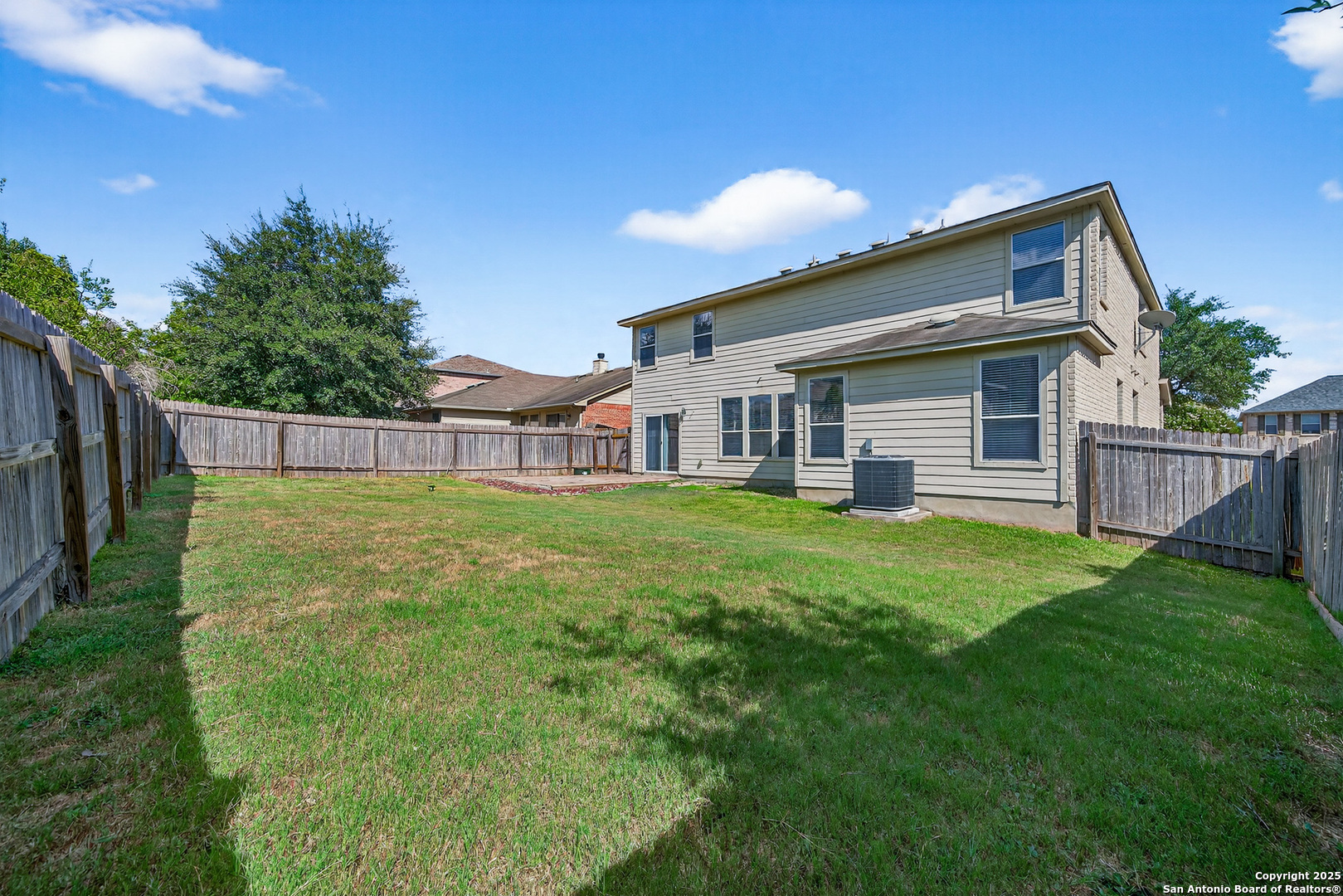 221 Springtree Cove Cibolo, TX 78108 - Photo 33 of 33 a view of a house with a backyard
