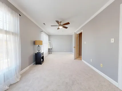 a bed room with a bed and a large window