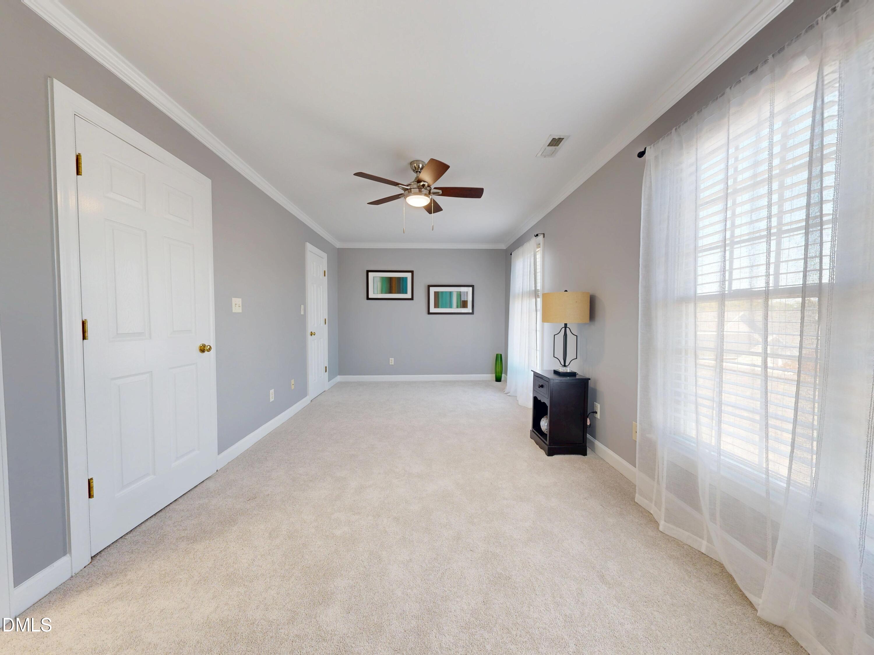 200 Madison Grove Place Cary, NC 27519 - Photo 23 of 49 a bed room with a bed and a large window