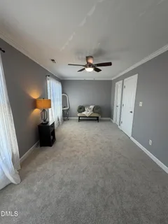 a bed room with a bed and a large window