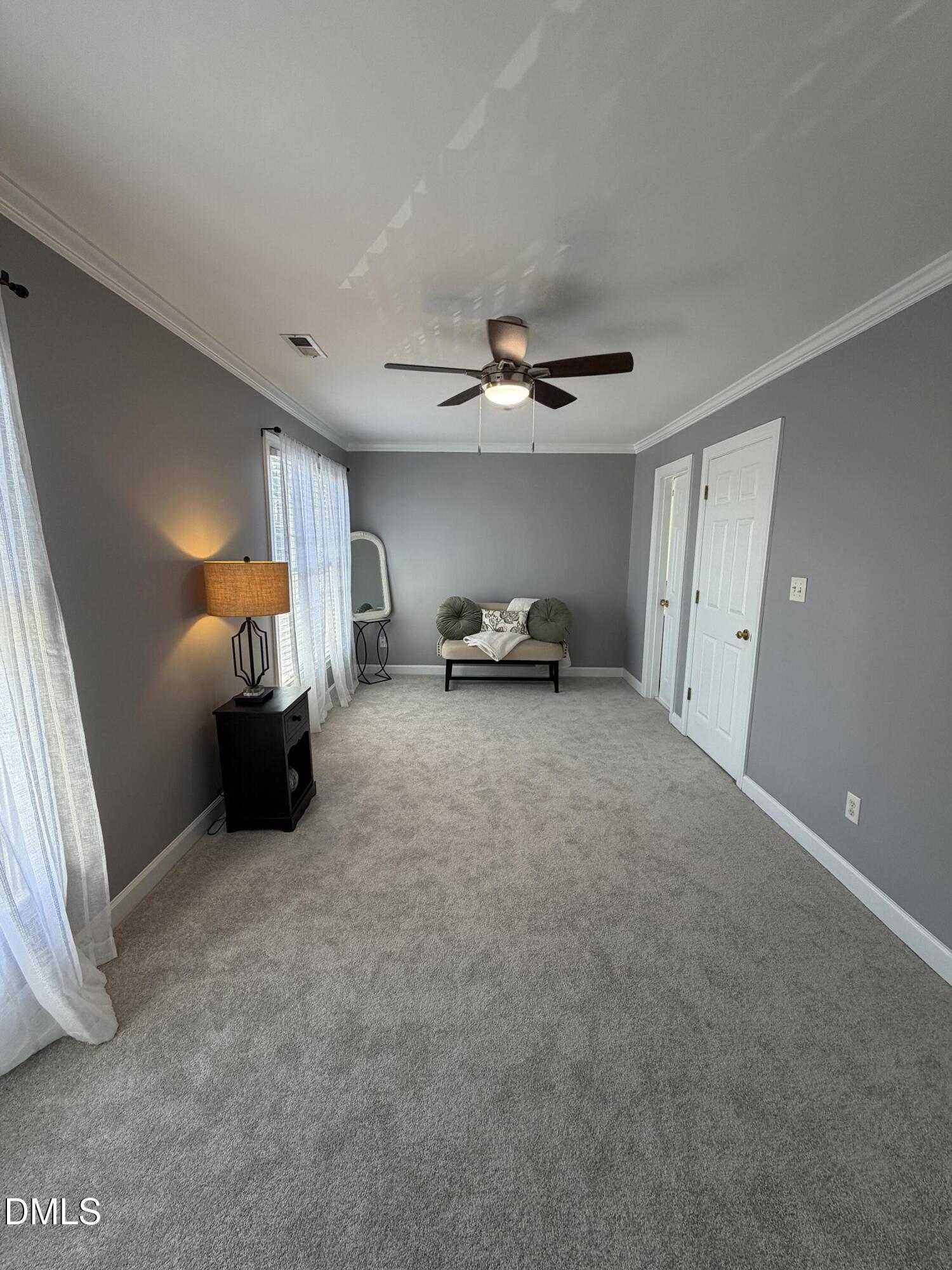 200 Madison Grove Place Cary, NC 27519 - Photo 24 of 49 a view of a livingroom with furniture and a ceiling fan